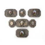 A collection of cut steel and enamel belt plaques, 19th century, each of cut-cornered rectangular