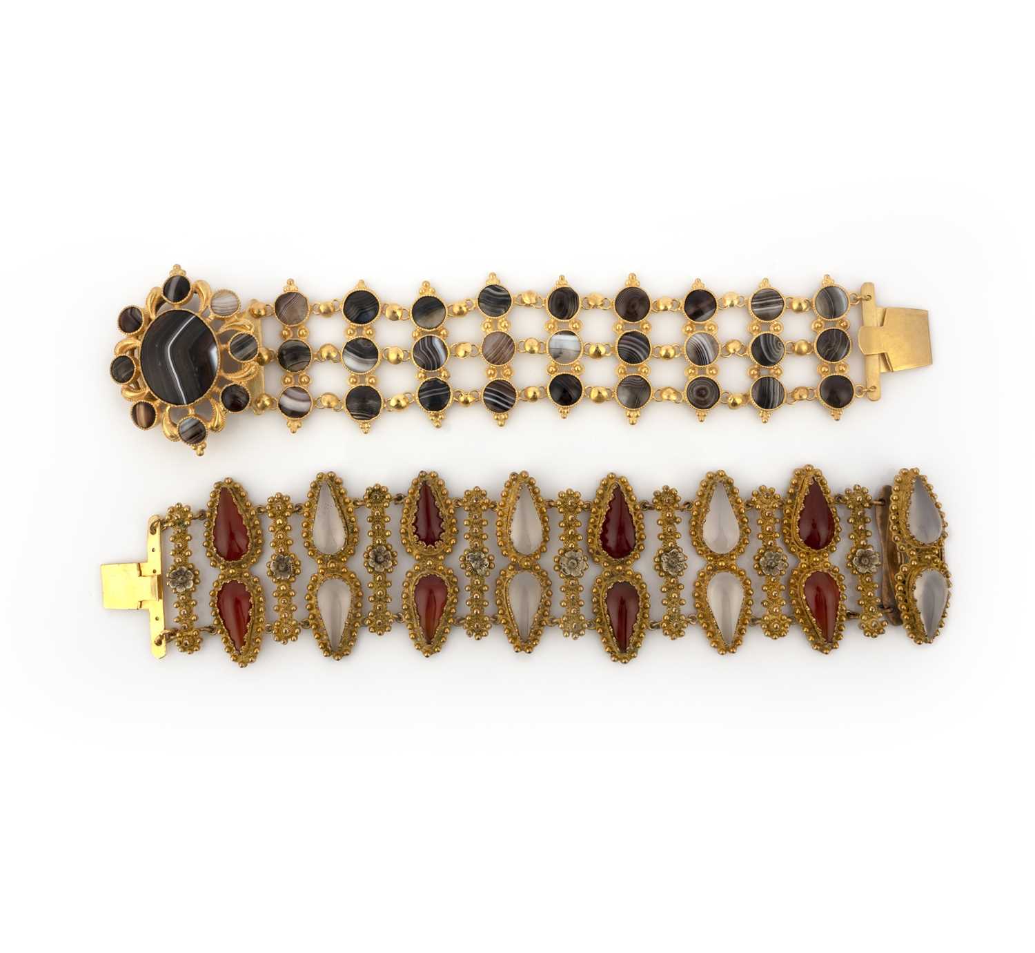Two gilt metal and hardstone bracelets, mid 19th century, one set with pear-shaped cabochons of