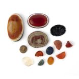 A collection of hardstone glyptics and fragments, comprising: an oval banded agate intaglio