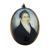 λ English School c.1800 Portrait miniature of a gentleman wearing a blue coat Oval, in a gilt