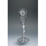 An ale glass of Jacobite significance, c.1760, the slender funnel bowl engraved with a rose and