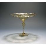 A façon de Venise tazza, late 16th/17th century, the fine glass of a pale yellow hue, the wide