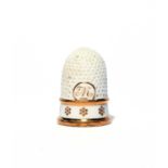 A Continental porcelain thimble, late 18th century, modelled with a wide band decorated with gilt