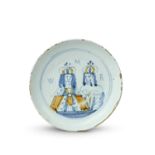 A London delftware Royal portrait plate or shallow dish, c.1690, painted in blue and ochre with