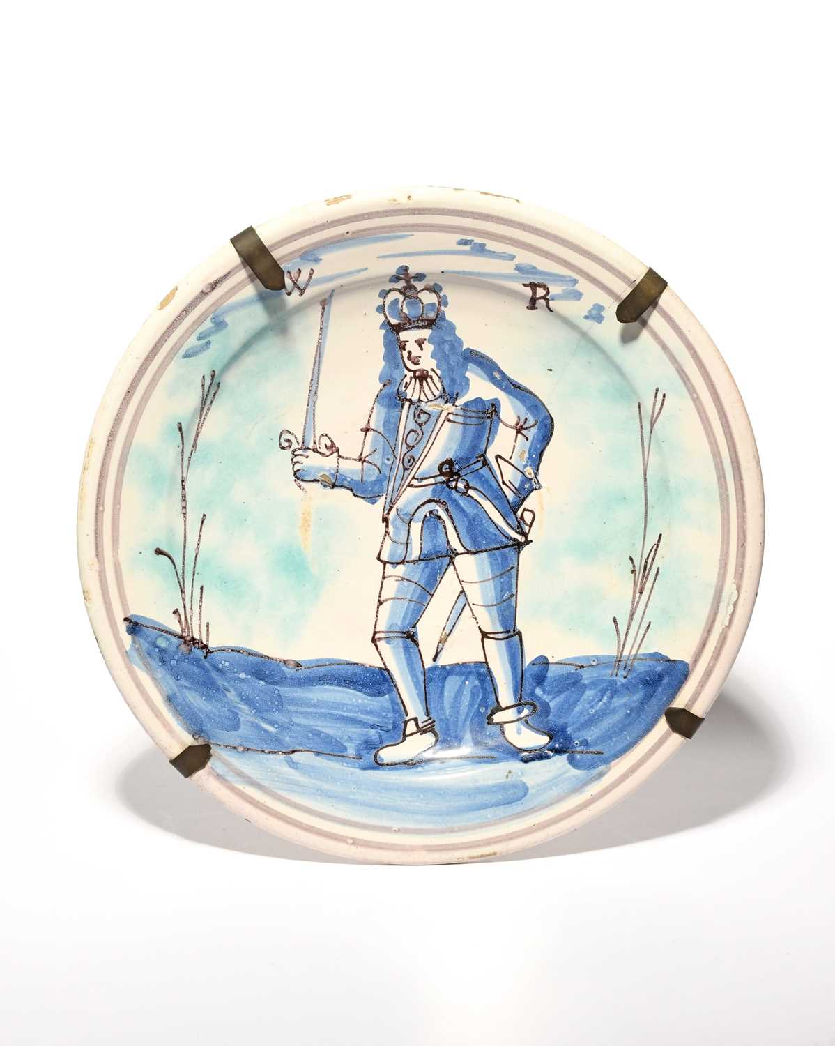 A delftware Royal charger, c.1690-1700, probably London, painted with a full-length standing - Image 2 of 2