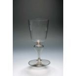 A large façon de Venise glass or goblet, late 17th century, the deep U-shaped bowl raised on a