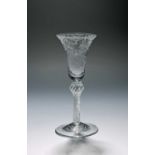 An unusual wine glass, c.1770, the bell bowl finely engraved with a formal design of interlaced