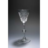 A Dutch-engraved Newcastle light baluster glass, c.1740-50, the round funnel bowl well engraved with