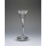 A wine glass of probable Jacobite significance, c.1750, the pan-topped bowl engraved with a band