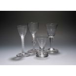 Three wine glasses, c.1760, two with vertical moulded flutes to the bowls, one on a plain stem,