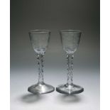A pair of small wine glasses of Jacobite significance, c.1770, the round funnel bowls engraved and