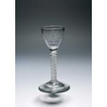 A small wine glass of possible Jacobite significance, c.1760, the slight ogee bowl engraved with a