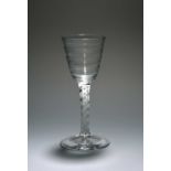 A large Lynn wine glass, c.1765, the round funnel bowl moulded with horizontal ribs, raised on a