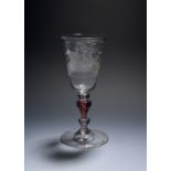 A Dutch engraved goblet, mid 18th century, the tall round funnel bowl engraved with a three-masted
