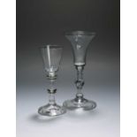 Two balustroid wine glasses, c.1740-50, one with a slender bell bowl over a plain stem with baluster