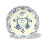 A Delft marriage plate, dated 1748, the well inscribed 'Edward and Sarah Brockett 1748' within a