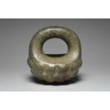 A Xochipala manopla Guerrero, Mexico, circa 900 - 600 BC speckled green stone, of padlock shape with