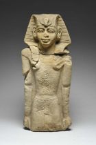 An Egyptian style pharaoh carved stone, three quarter length and wearing a tripartite wig with an