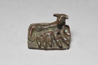 An Egyptian bronze dog with litter group Late Period / Ptolemaic Period, circa 500 - 30 BC reclining