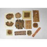 Twelve Coptic textile fragments circa 5th century AD depicting figures, animals and foliage, the