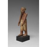 An Egyptian wood boatman Middle Kingdom, circa 2030 - 1650 BC with painted decoration and