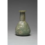 A Roman marbled glass toilet bottle circa 1st century AD green with white striations and of pear