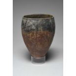 An Egyptian black topped pottery jar Predynastic Period, circa 4000 - 3200 BC of ovoid form with a