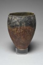 An Egyptian black topped pottery jar Predynastic Period, circa 4000 - 3200 BC of ovoid form with a
