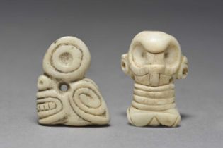 Two Taino amulets Dominican Republic, circa 1100 - 1500 AD shell, one carved as a skeletal head with