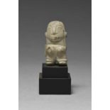 A Taino figural amulet Dominican Republic, circa 1000 - 1500 AD stone, carved standing with hands on