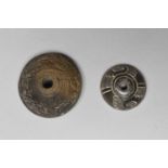 Two Mexican spindle whorls circa 10th - 16th century AD pottery, the larger with carved decoration