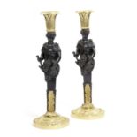 A PAIR OF GILT AND PATINATED BRONZE TERM CANDLESTICKS IN EMPIRE STYLE, 19TH CENTURY each term