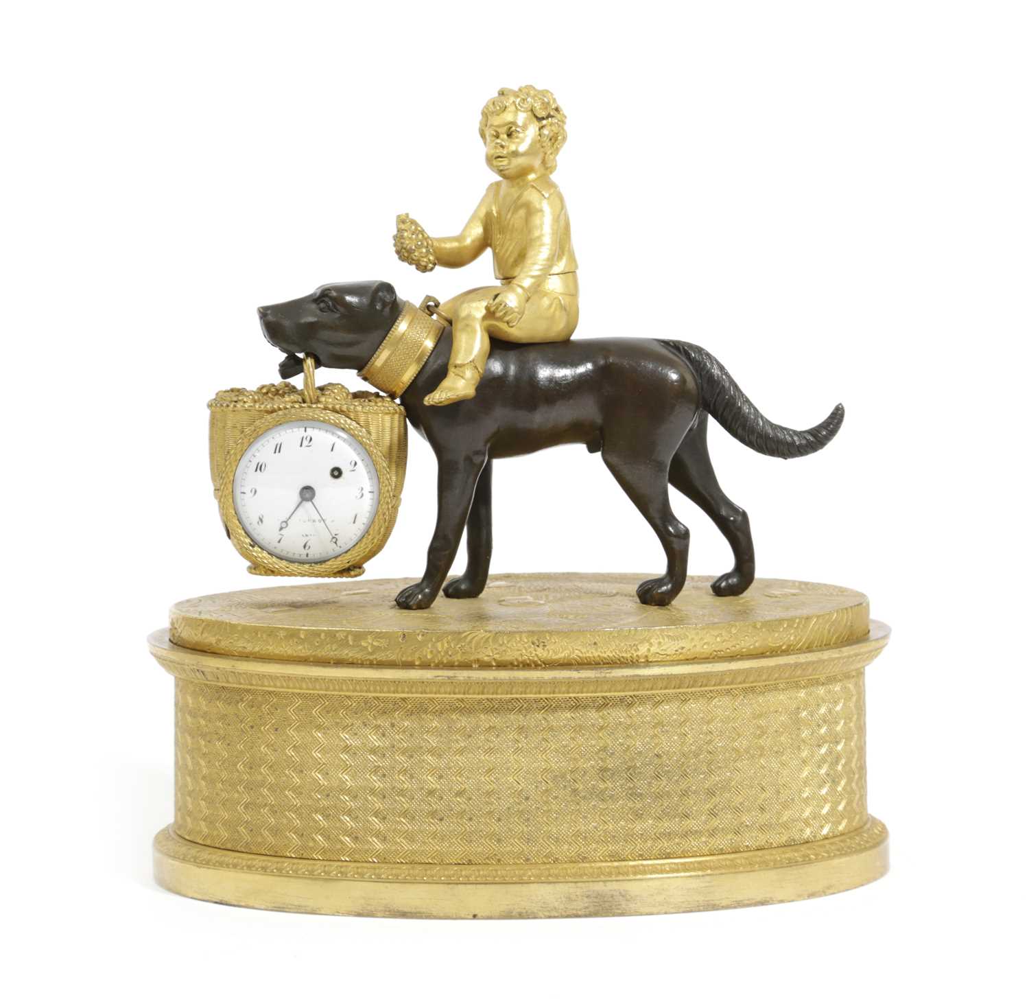 AN EMPIRE GILT AND PATINATED BRONZE CLOCK DESKSTAND C.1820 modelled as a child sat astride a dog