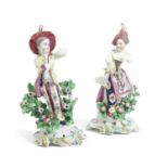 A PAIR OF BOW PORCELAIN FIGURES OF THE NEW DANCERS C.1760 standing in a dancing pose, on scrolling