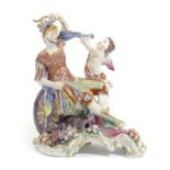 A BOW PORCELAIN GROUP OF MARS AND CUPID C.1760 Mars modelled seated with his attributes at his feet,