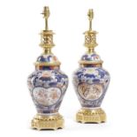 A PAIR OF JAPANESE IMARI PORCELAIN AND ORMOLU MOUNTED VASE TABLE LAMPS 20TH CENTURY painted with