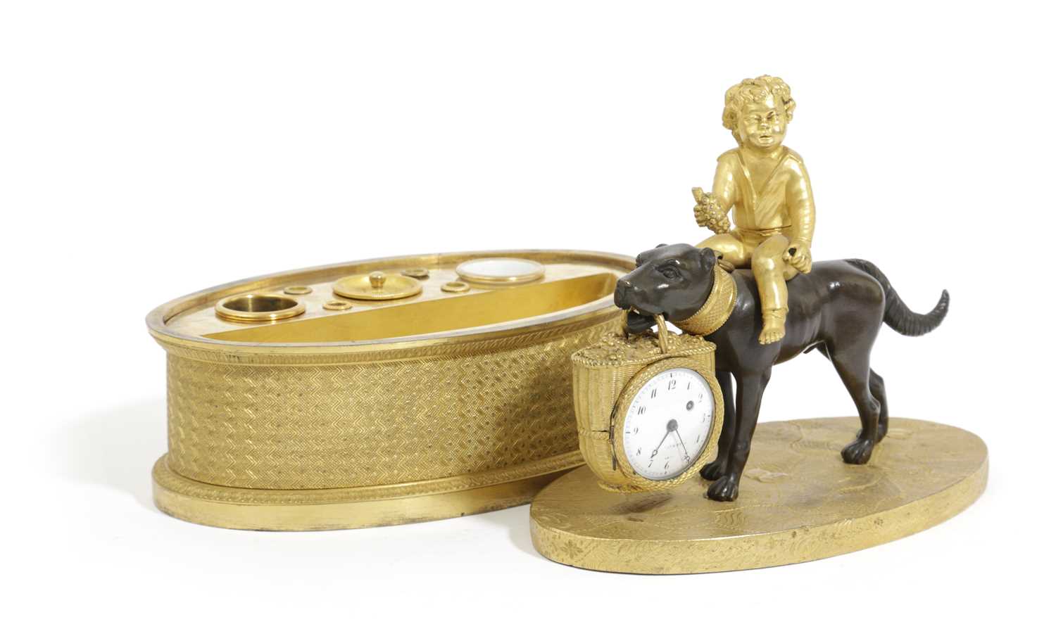 AN EMPIRE GILT AND PATINATED BRONZE CLOCK DESKSTAND C.1820 modelled as a child sat astride a dog - Image 2 of 2