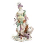 A DERBY PORCELAIN FIGURE OF BRITANNIA C.1760-70 modelled standing with a globe, a lion and