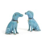 A PAIR OF CHINESE PORCELAIN FIGURES OF DOGS QING DYNASTY modelled seated, with a turquoise glaze (2)