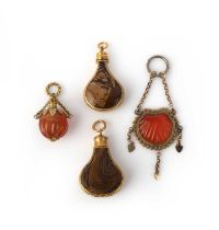 Four hardstone pendants, first half 19th century, comprising: two jasper scent bottles, mounted in