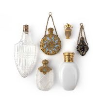 Five perfume bottles and a hardstone charm pendant, 19th century, comprising: a faceted glass