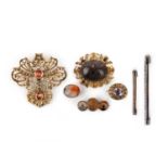 A group of seven brooches, 18th/19th century, comprising: a brooch set with a cabochon rock