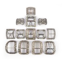 A collection of paste shoe buckles and a pair of brooches, late 18th/early 19th century, comprising: