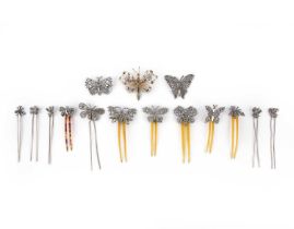 λ A group of cut steel brooches and hair pins, 19th century, comprising: twelve hair pins and
