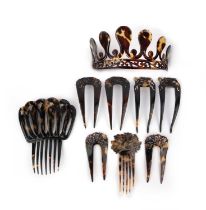 λ A collection of tortoiseshell hair ornaments, 19th century, comprising: two hair combs, largest