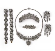 A suite of cut steel jewels, 19th century, comprising: a hair ornament, length 11cm; a pair of