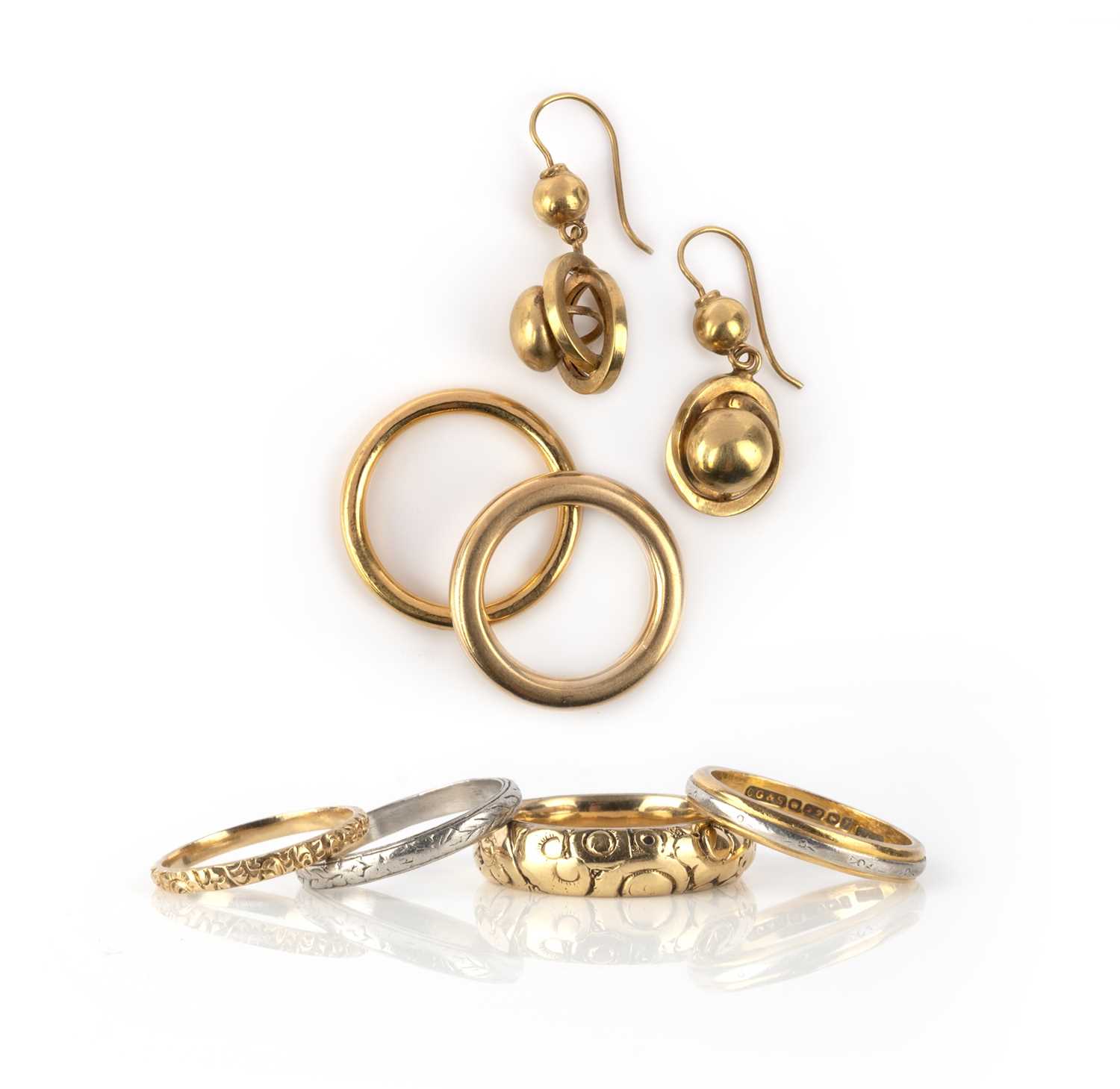 Six wedding bands and a pair of earrings, 19th and early 20th century, comprising: two gold bands