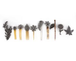 λ A group of cut steel brooches and hair pins, 18th/19th century, comprising: seven hair pins and