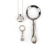 No reserve - Tiffany & Co., three silver objects, comprising: a silver magnifying glass and