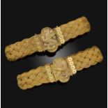 A cased pair of early 19th century bracelets, each clasp depicting a dove facing in alternate